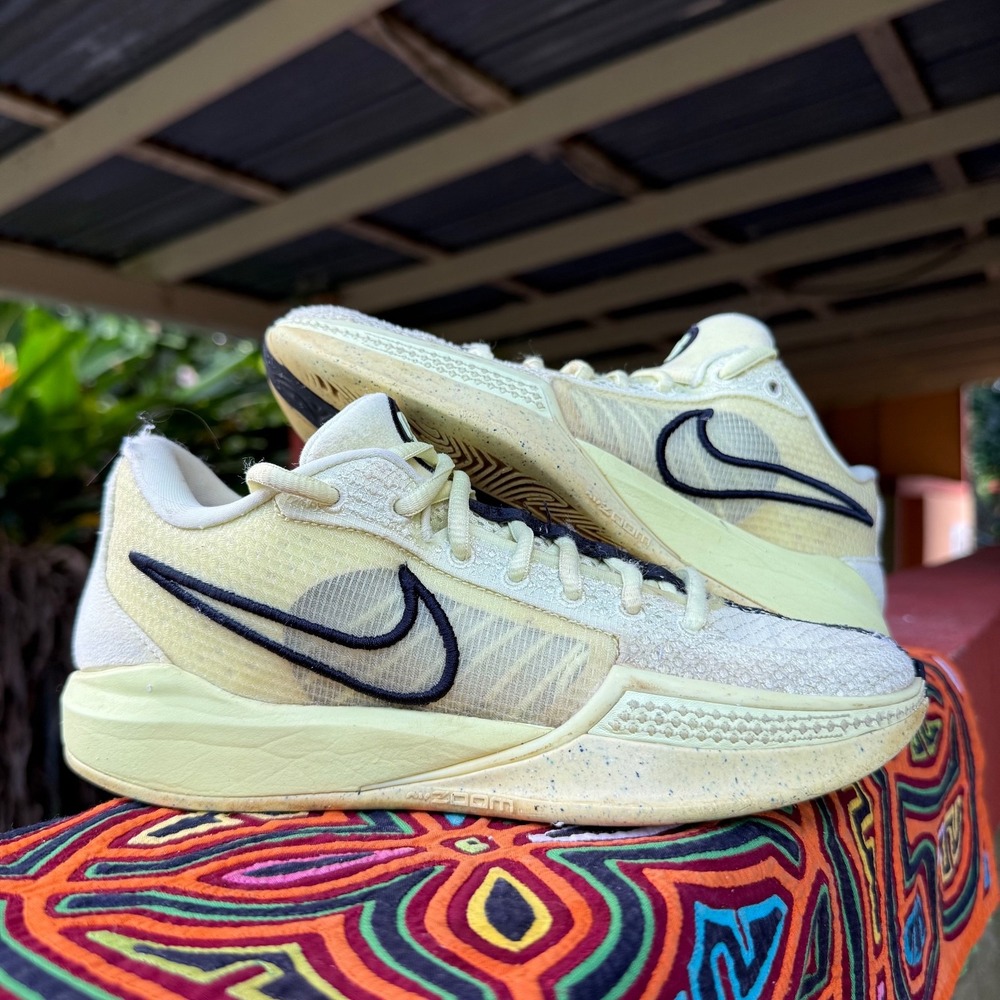 Nike Women's Pale Yellow Low-Top Sneakers with Black Swoosh